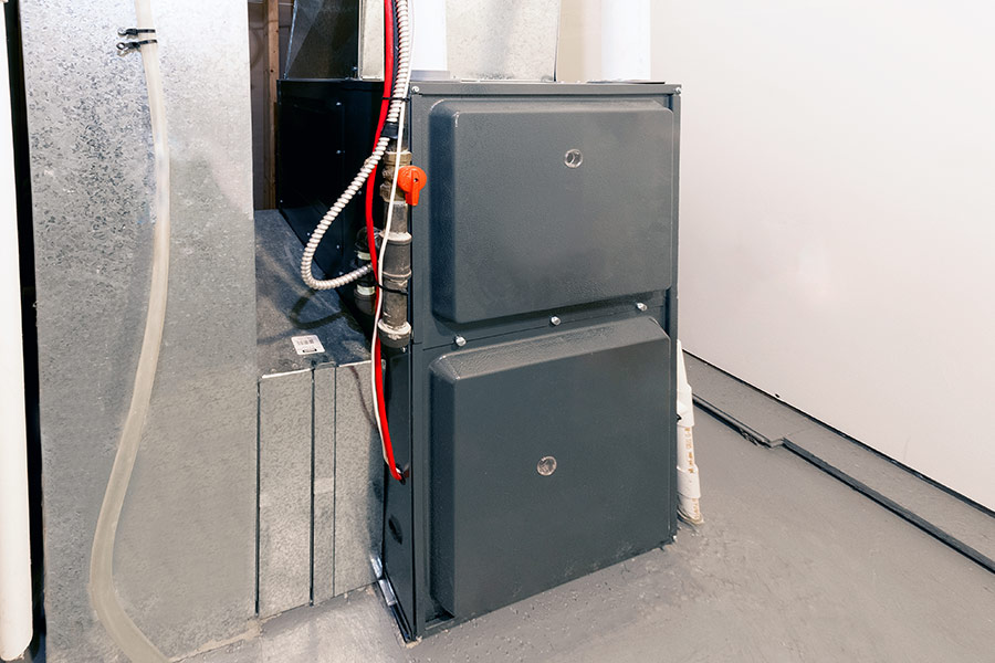 Modern residential furnace unit in a utility room